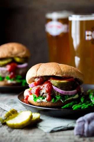 These Portobello and Swiss Beef Burgers are a healthier make-over of the all-American classic. And they’re ready in under 30 minutes, so you can get a delicious kid-friendly dinner on the table lickety-split! | Healthy Seasonal Recipes | Katie Webster