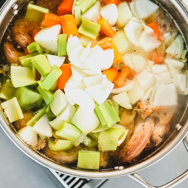 Add the onion, carrot and celery to the stock and simmer for 1 hour.