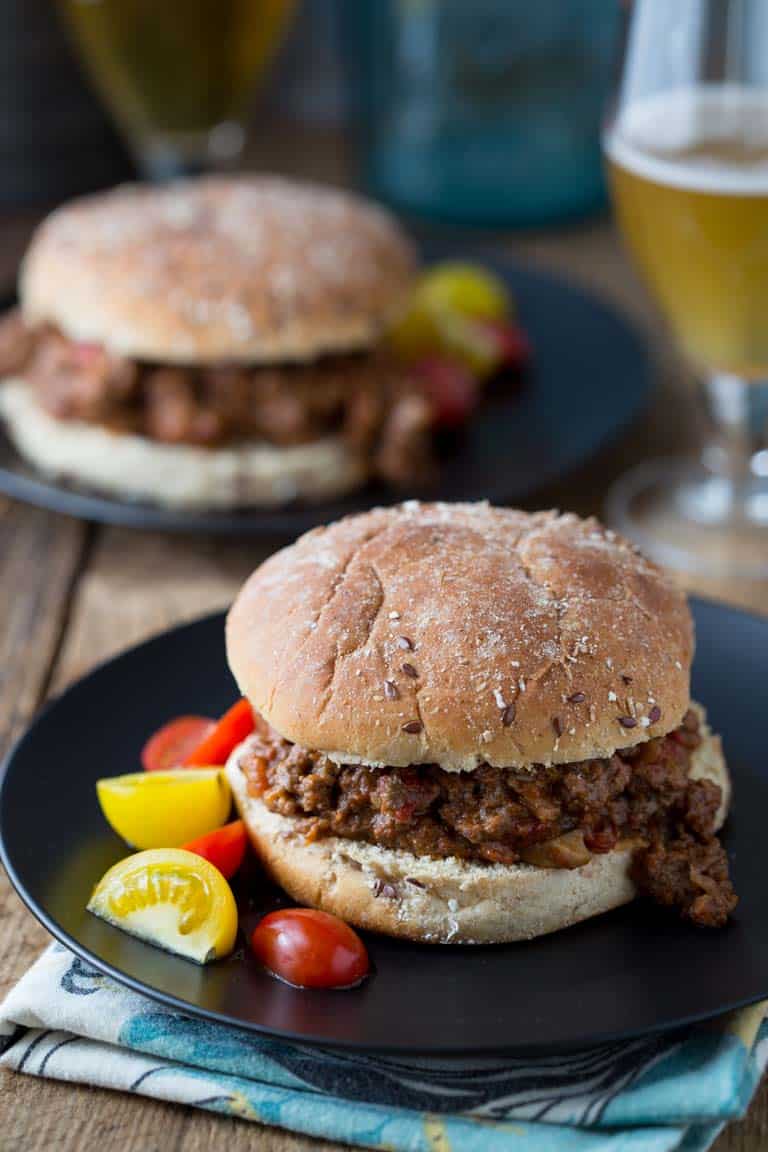 Healthy Sloppy Joes on plates with cherry tomatoes 