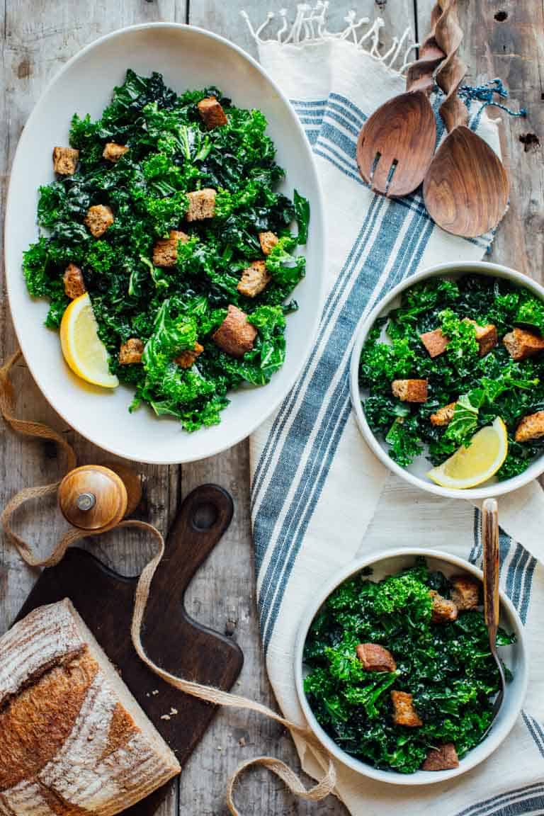Make ahead kale salad in two large serving bowls 