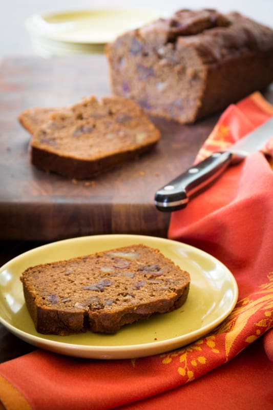 gluten free date bread slice on a green plate