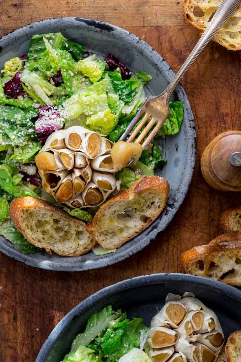 Garlic Lover's Roasted Garlic Caesar Salad, with roasted garlic in the dressing and a whole head of roasted garlic to go on each serving! The dressing is egg-free and it has capers in it!! | Healthy Seasonal Recipes | Katie Webster