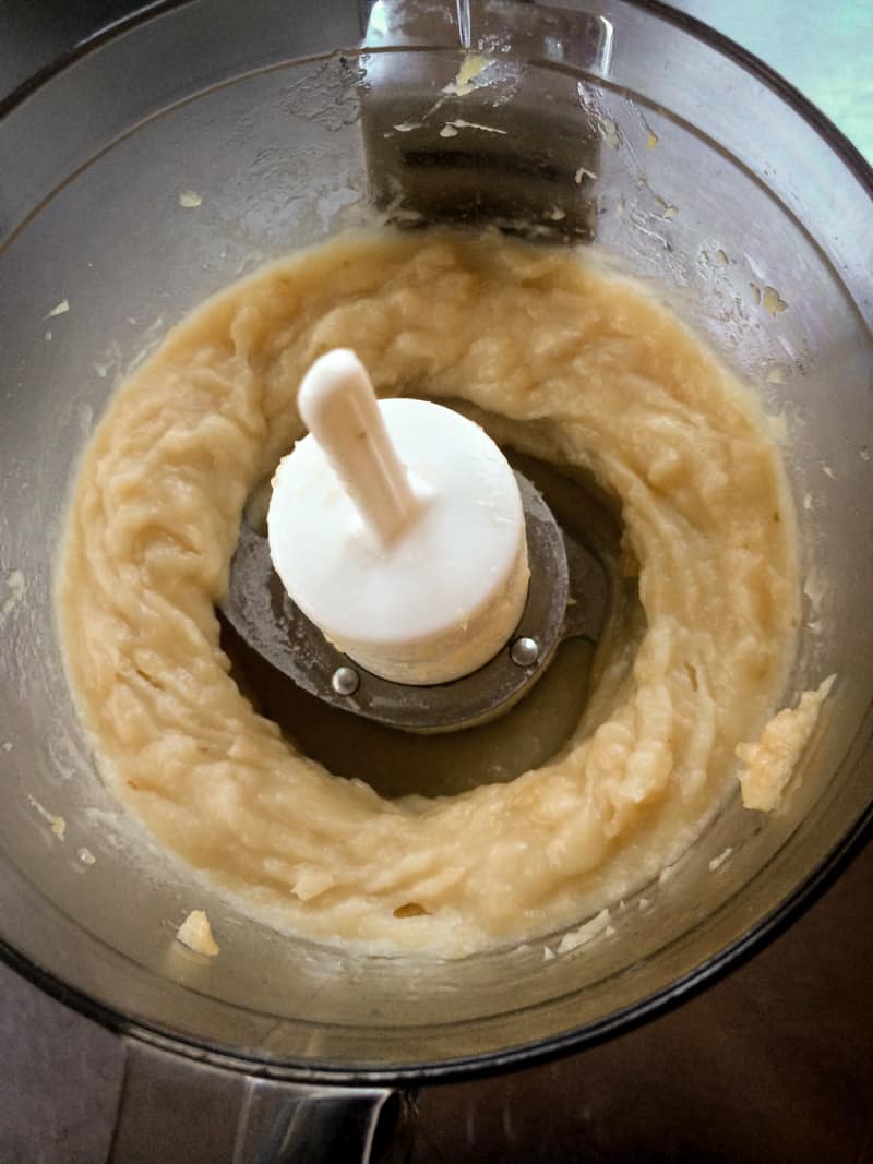 mixing garlic in a food processor