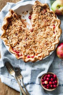 cranberry crumb apple pie overhead on a blue napkin