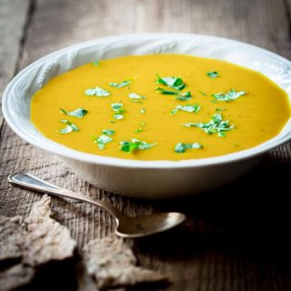 Clean Eating Curry Butternut Squash Soup with coconut milk. Only 180 creamy delicious calories per bowl. Gluten-free, paleo and vegan. Perfect cure for the overindulgences of the holiday season. This soup will set you right! on healthyseasonalrecipes.com