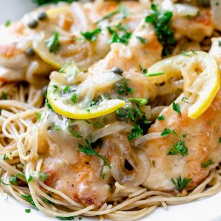 a close up of chicken piccata