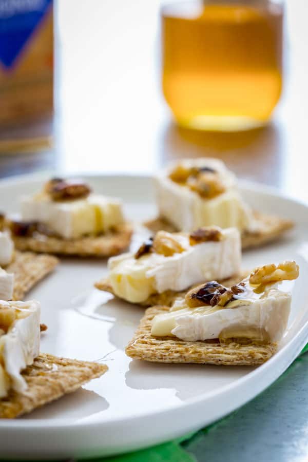 brie on Triscuit crackers with walnuts and honey