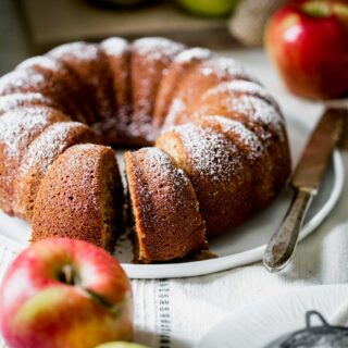 the bundt cut into slices with an apple in front