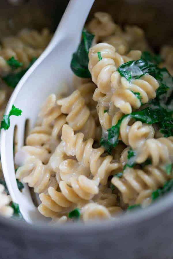 Mac and Cheese with Kale with serving spoon