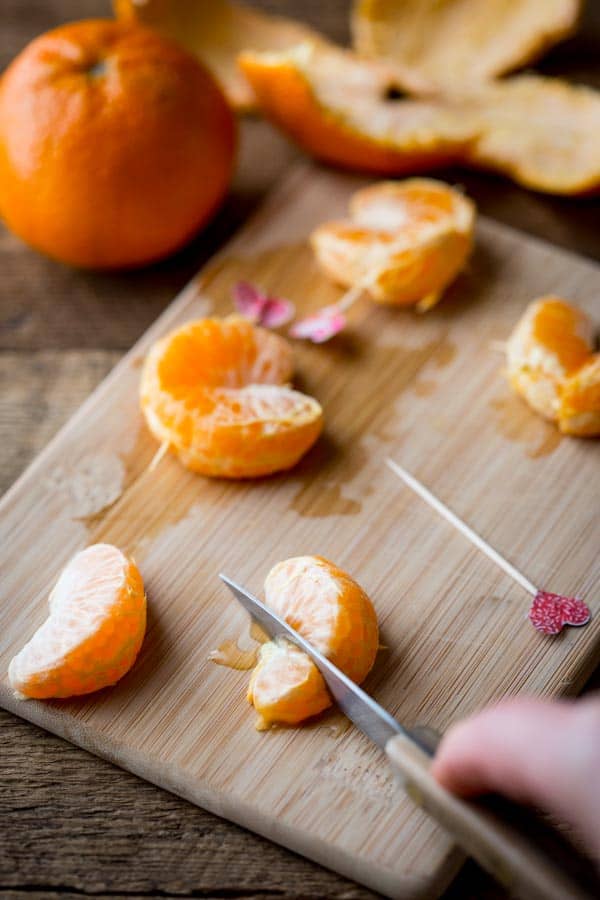 cutting the clementine for heart-shaped Cuties by Katie Webster on HealthySeasonalRecipes.com