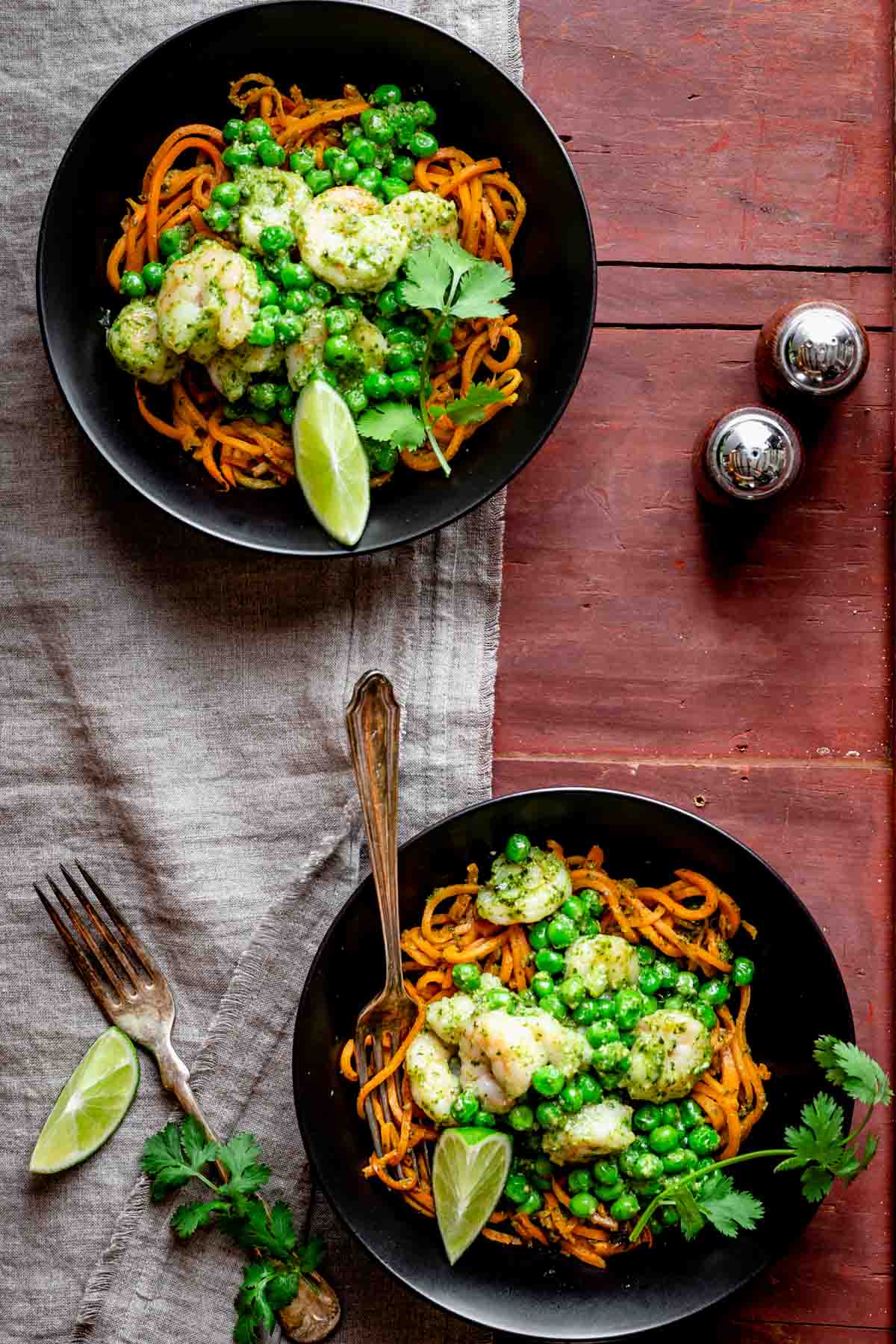 two bowls of the sweet potato noodles with shrimp, peas and pesto