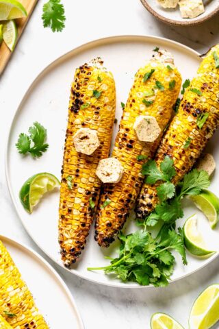 Grilled Corn with compound butter on it