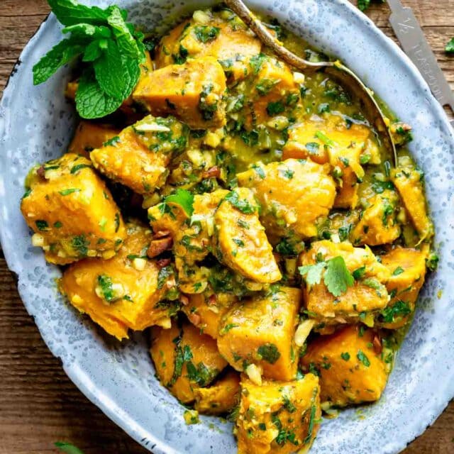 a metal dish with sweet potato curry