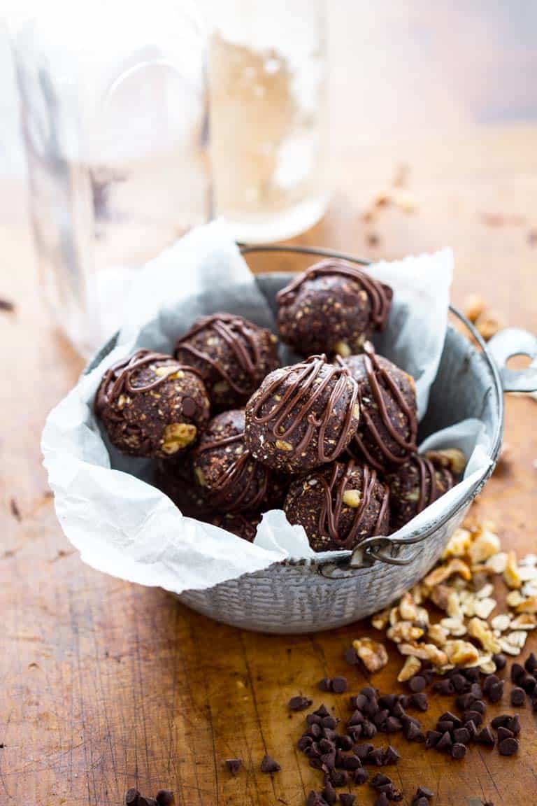 Dark chocolate walnut vegan energy balls in a bowl.