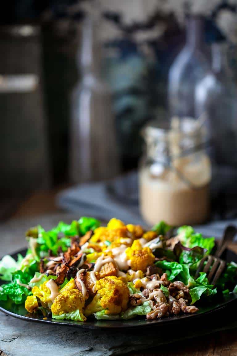 These Turmeric Roasted Cauliflower and Tempeh Power Salads make a delicious and filling vegan lunch or dinner. They have 10 hunger-busting grams of fiber, 12 grams of plant-based protein and only 322 calories each! Healthy Seasonal Recipes | Katie Webster