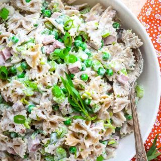 close up overhead of pasta salad with peas and ham