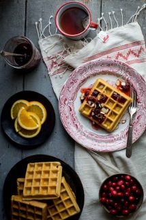 On Christmas Morning, wake up to these Almond Waffles with Cranberry Orange Honey Syrup. The whole family will love them. You can make the honey syrup ahead and do some of the prep ahead so they are easy to make. | Healthy Seasonal Recipes #breakfast #Christmasbreakfast #cranberry #healthy #morning
