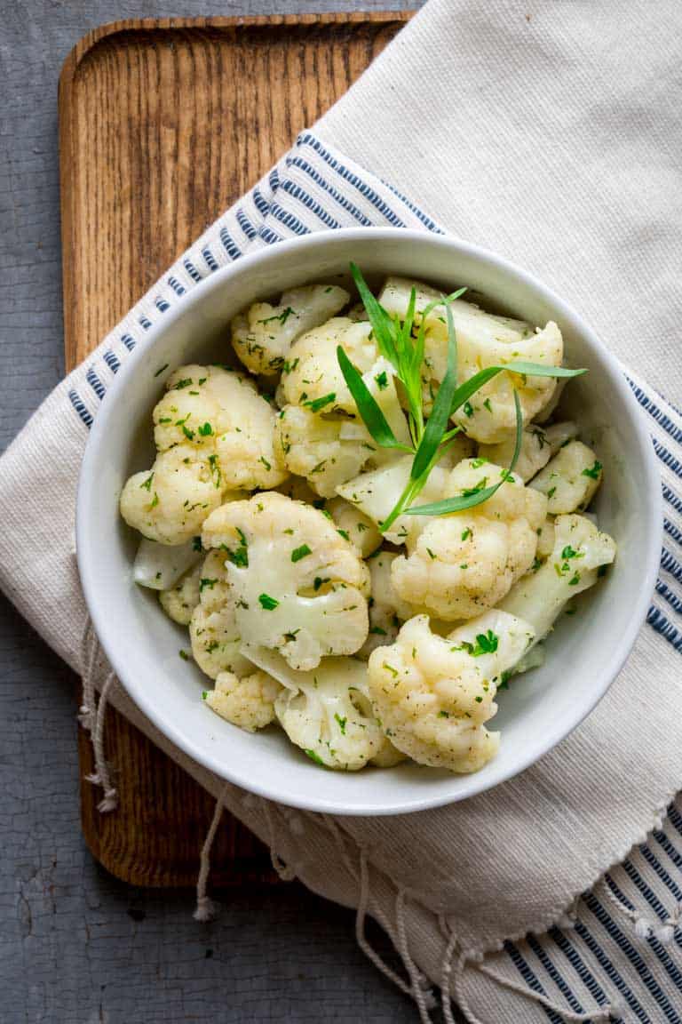 Simple Steamed Cauliflower with Herbs on Healthy Seasonal Recipes. Only 45 calories per serving. Low-carb and gluten-free #lowcarb #glutenfree #keto #cauliflower #sidedish #lowcalorie