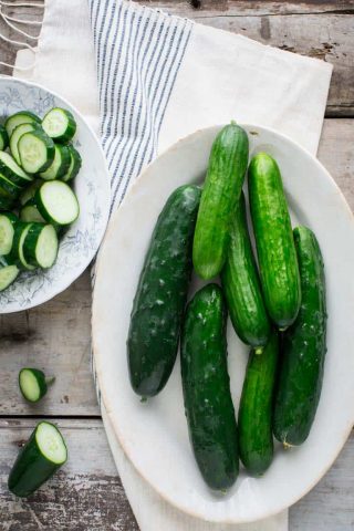 Have you ever wondered about why your cucumbers are bitter? Or whether or not you can freeze cucumbers? And what about how to grow cucumbers? Look no further than this Ultimate Guide to Cucumbers. These crunchy, refreshing veg is popular for good reason. See your questions answered below, along with cucumber recipes for inspiration. Healthy Seasonal Recipes by Katie Webster | #cucumber #summer #produce #fresh #gardening #cooking