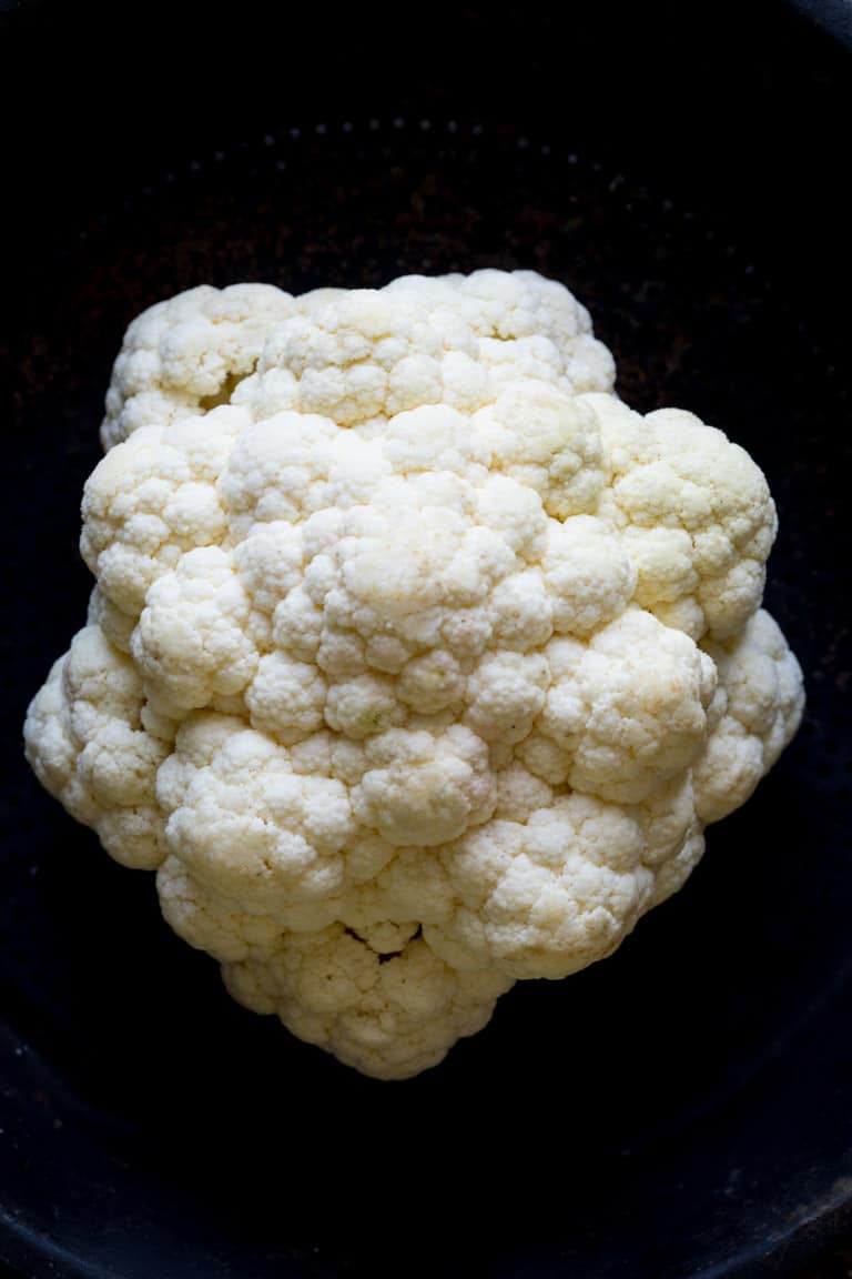 Ever wondered is you can regrow cauliflower? Are cauliflower stalks edible? How do you make cauliflower rice? Read up on cauliflower growing info, culinary tips and nutrition in this Ultimate Guide to Cauliflower. Healthy Seasonal Recipes by Katie Webster | #cauliflower #seasonal #produce #fresh #guide 