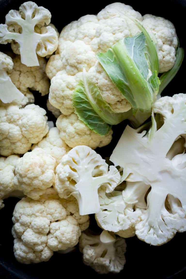 Ever wondered is you can regrow cauliflower? Are cauliflower stalks edible? How do you make cauliflower rice? Read up on cauliflower growing info, culinary tips and nutrition in this Ultimate Guide to Cauliflower. Healthy Seasonal Recipes by Katie Webster | #cauliflower #seasonal #produce #fresh #guide