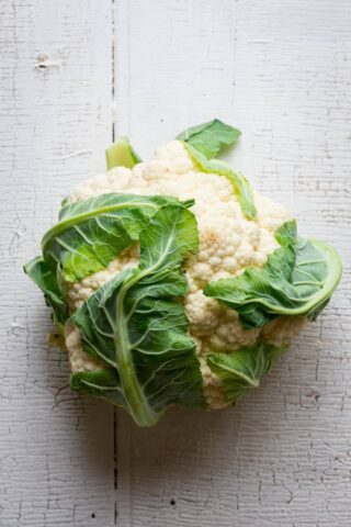 Ever wondered is you can regrow cauliflower? Are cauliflower stalks edible? How do you make cauliflower rice? Read up on cauliflower growing info, culinary tips and nutrition in this Ultimate Guide to Cauliflower. Healthy Seasonal Recipes by Katie Webster | #cauliflower #seasonal #produce #fresh #guide