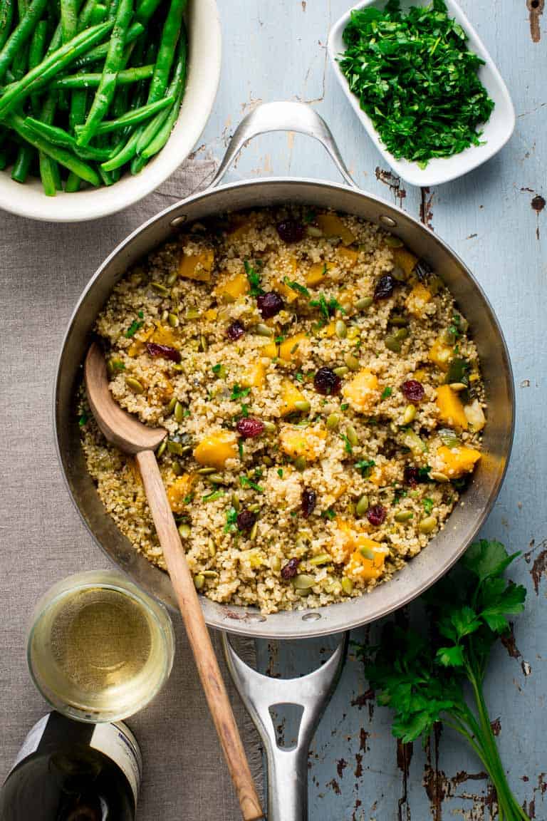 Please tell me you won't wait until Thanksgiving to try this Vegetarian Thanksgiving Pilaf with Pumpkin and Quinoa! It is too good to wait, and now that fresh pie pumpkins are in season, I highly recommend that you make it for dinner or serve it as a side dish. Seriously, don't wait. It's made with dried cranberries, leek and orange zest and it's naturally vegan and gluten-free so all the people will love it!Â #vegetarian #thanksgiving #pumpkin #quinoa #vegan #glutenfree #healthy #sidedish #onepot #stovetop #pilaf
