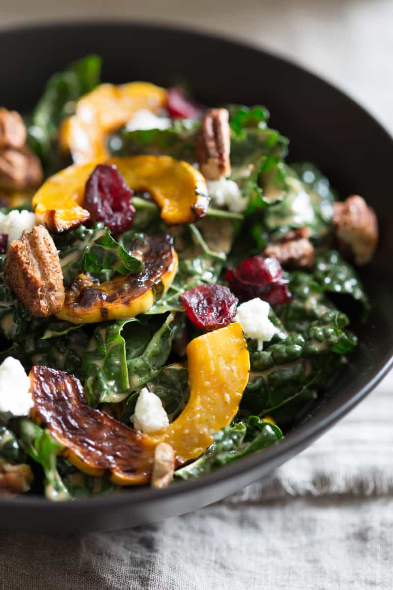 kale salad with delicata squash, cranberries, goat cheese and spiced pecans