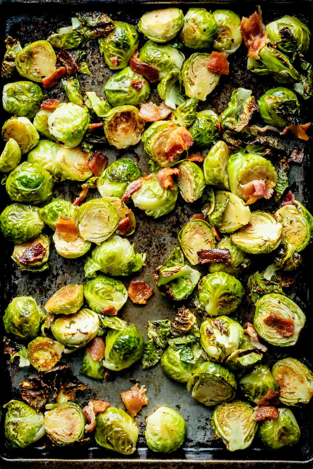 close up of the roasted brussels sprouts on a sheet pan