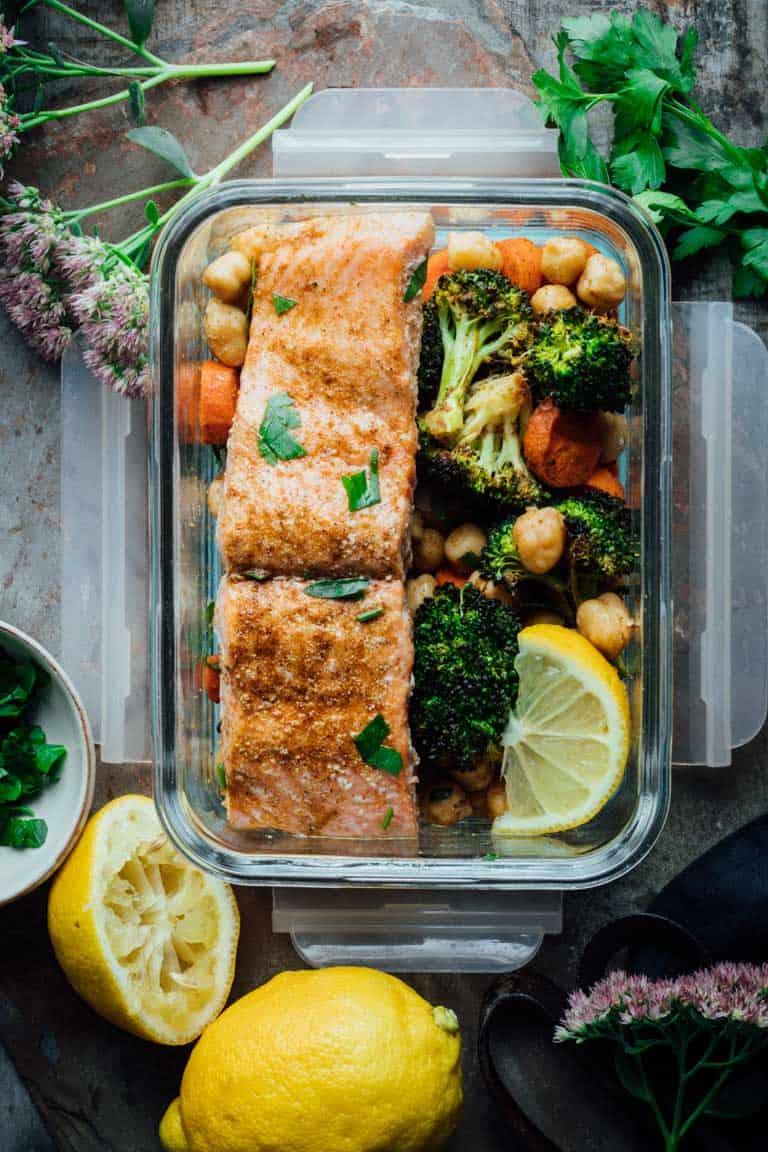 overhead look at Moroccan salmon with chickpeas and vegetables in a container