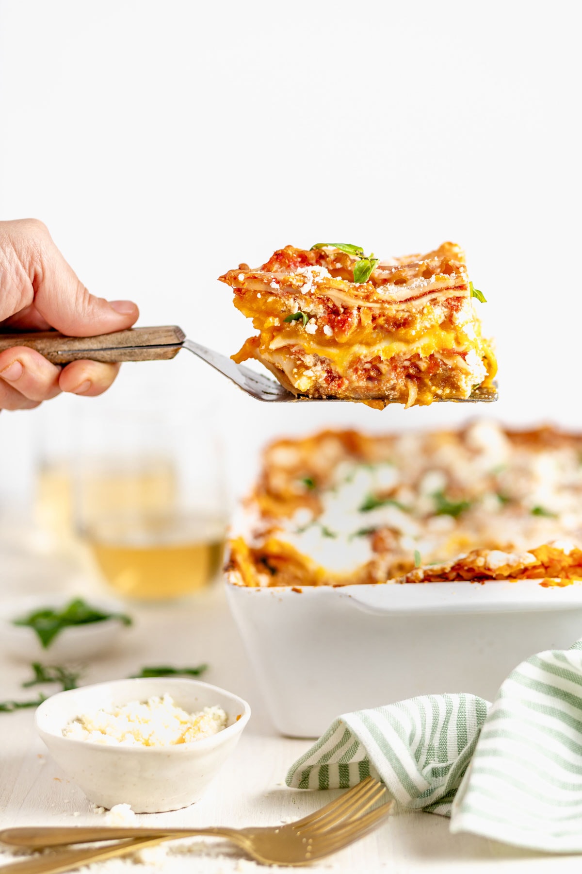 A slice of the lasagna on a spatula from the side