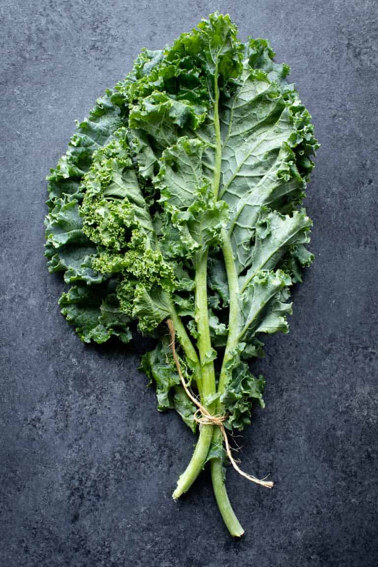 curly kale on black surface