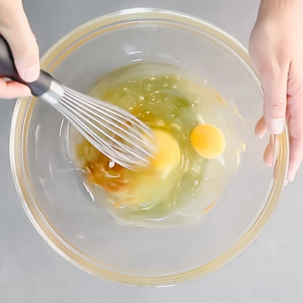 Whisk egg, oil, honey and vanilla in a large bowl.
