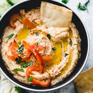 close up of roasted red pepper hummus