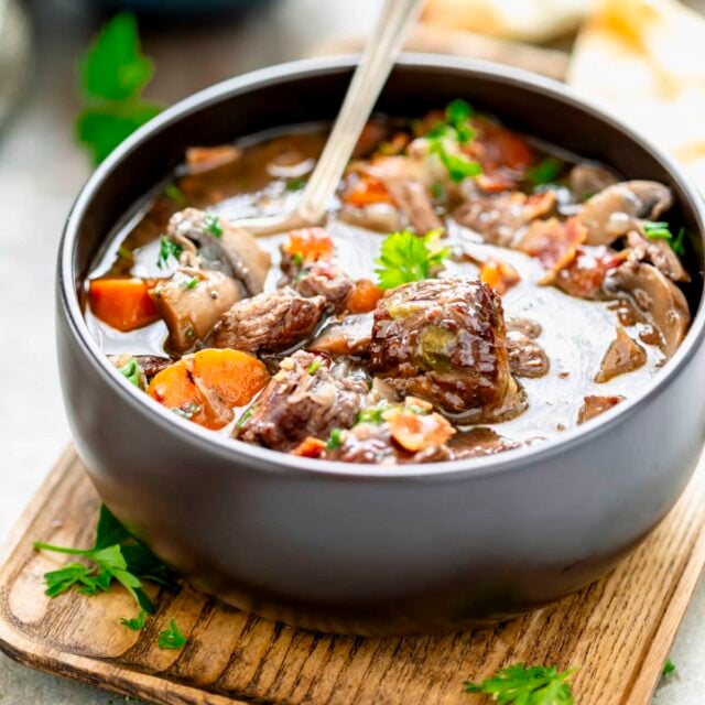 Healthy slow cooker beef burgundy with mushrooms and bacon in red wine sauce