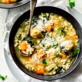 the wedding soup in a black bowl