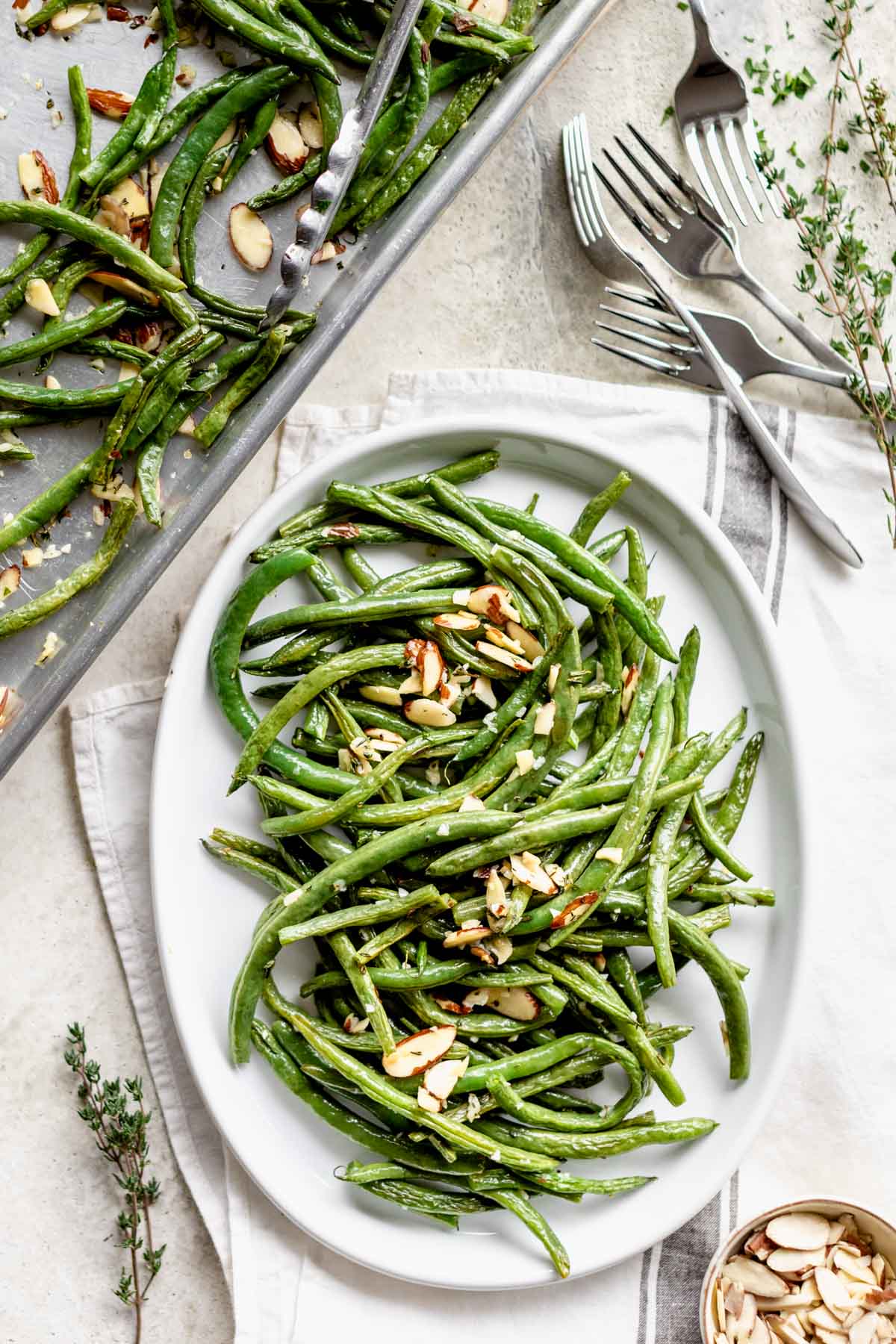 Roasted Green beans with almonds on a platter with text