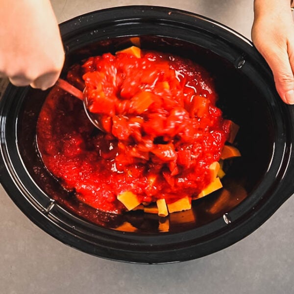 Combine the veggies and tomatoes in the slow cooker