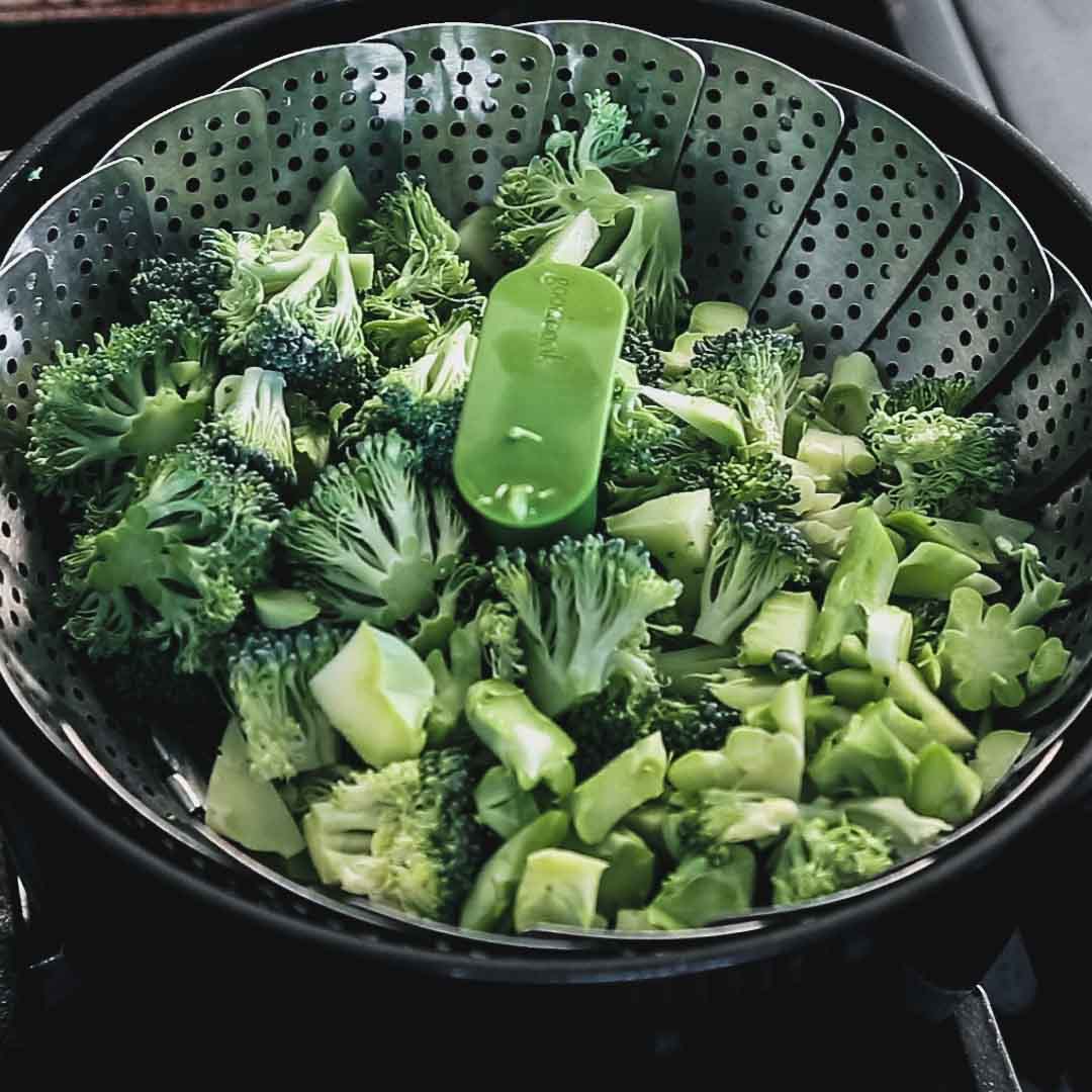 the broccoli in a steamer basket
