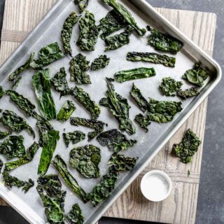 a sheet pan of kale chips after it came out of the oven