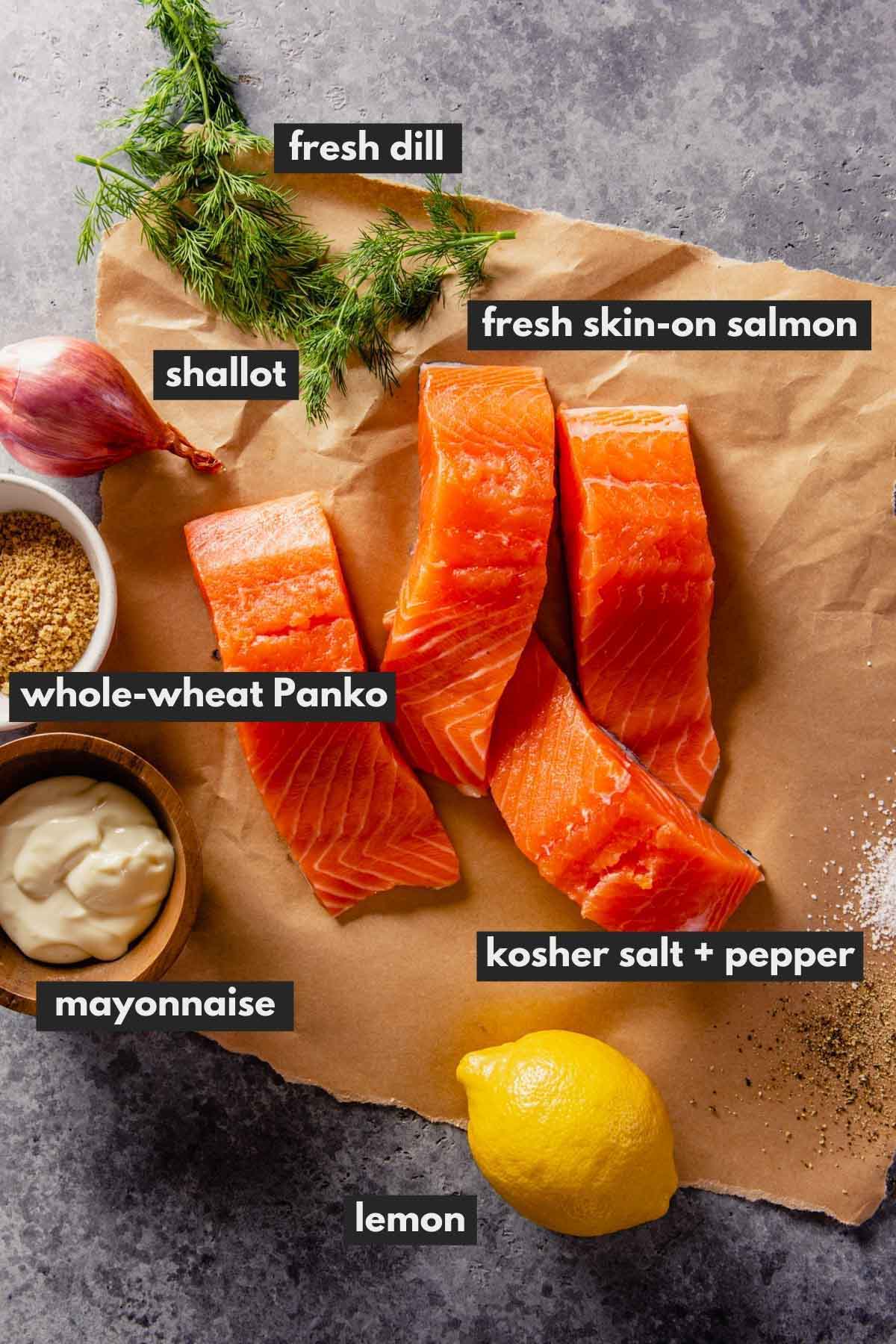salmon filets, lemon, dill, mayo, breadcrumbs and shallot set out on a counter
