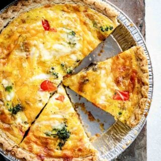 overhead photo of healthy quiche with triangular slices cut into the pie.