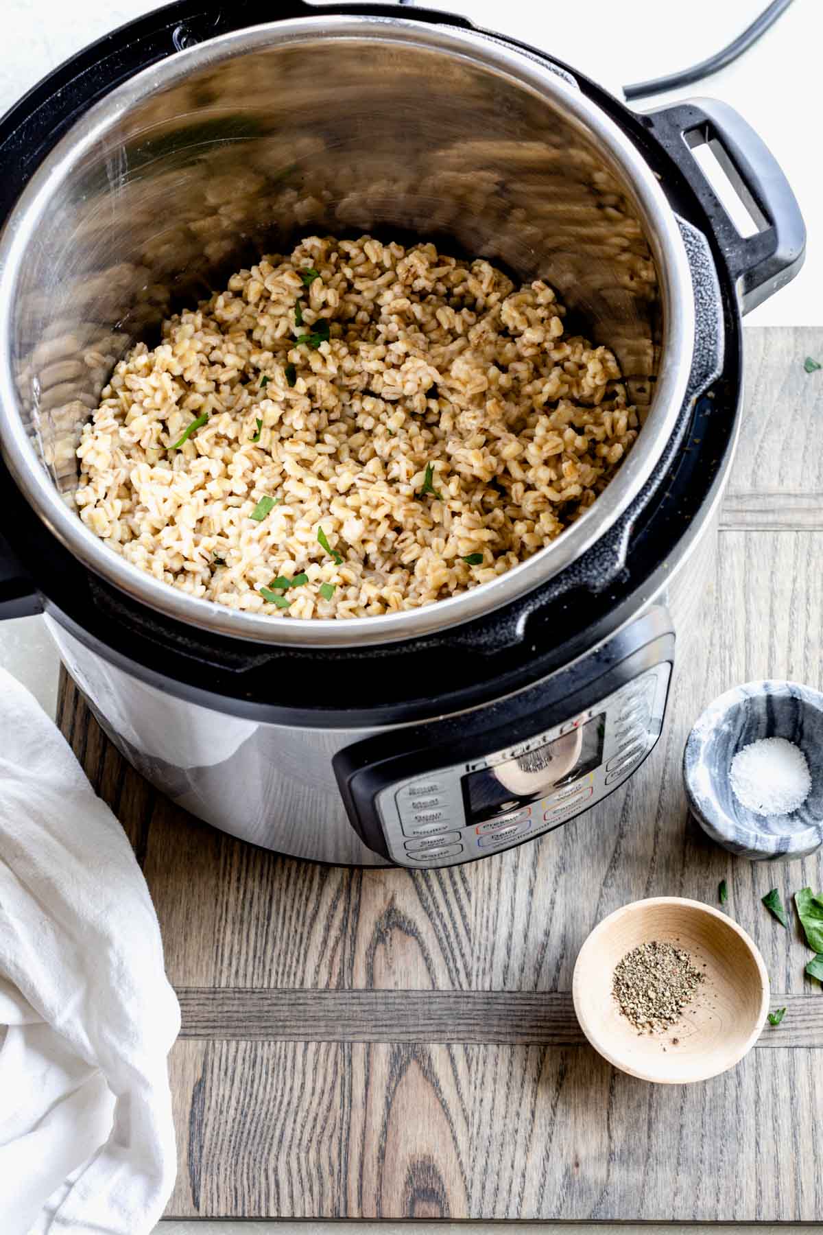 a view into an instant pot with cooked barley in it