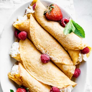 crepes in a platter with berries