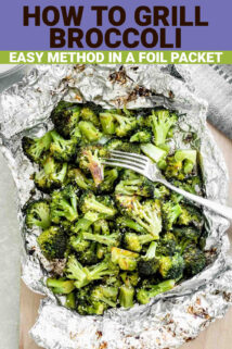 grilled broccoli in tin foil with a fork in it