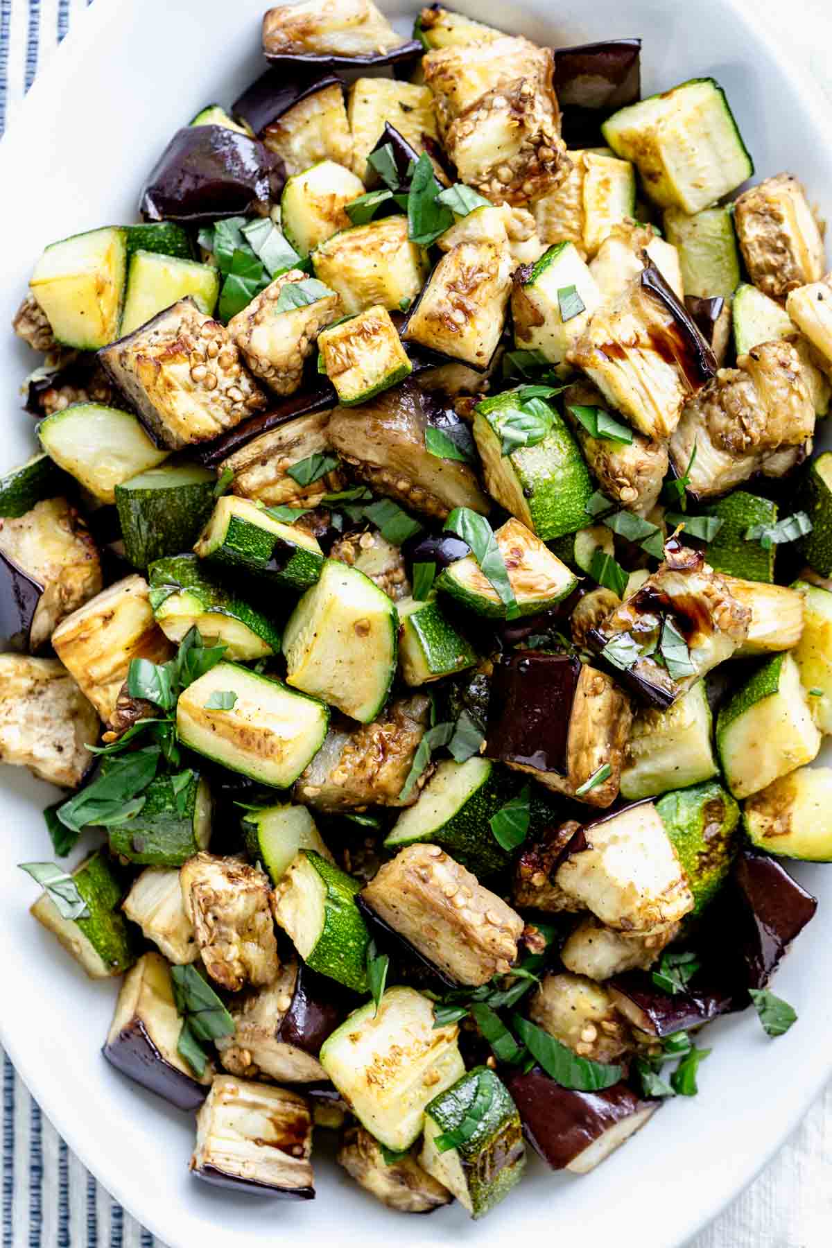 roasted eggplant and zucchini drizzled with balsamic vinegar and garnished with basil