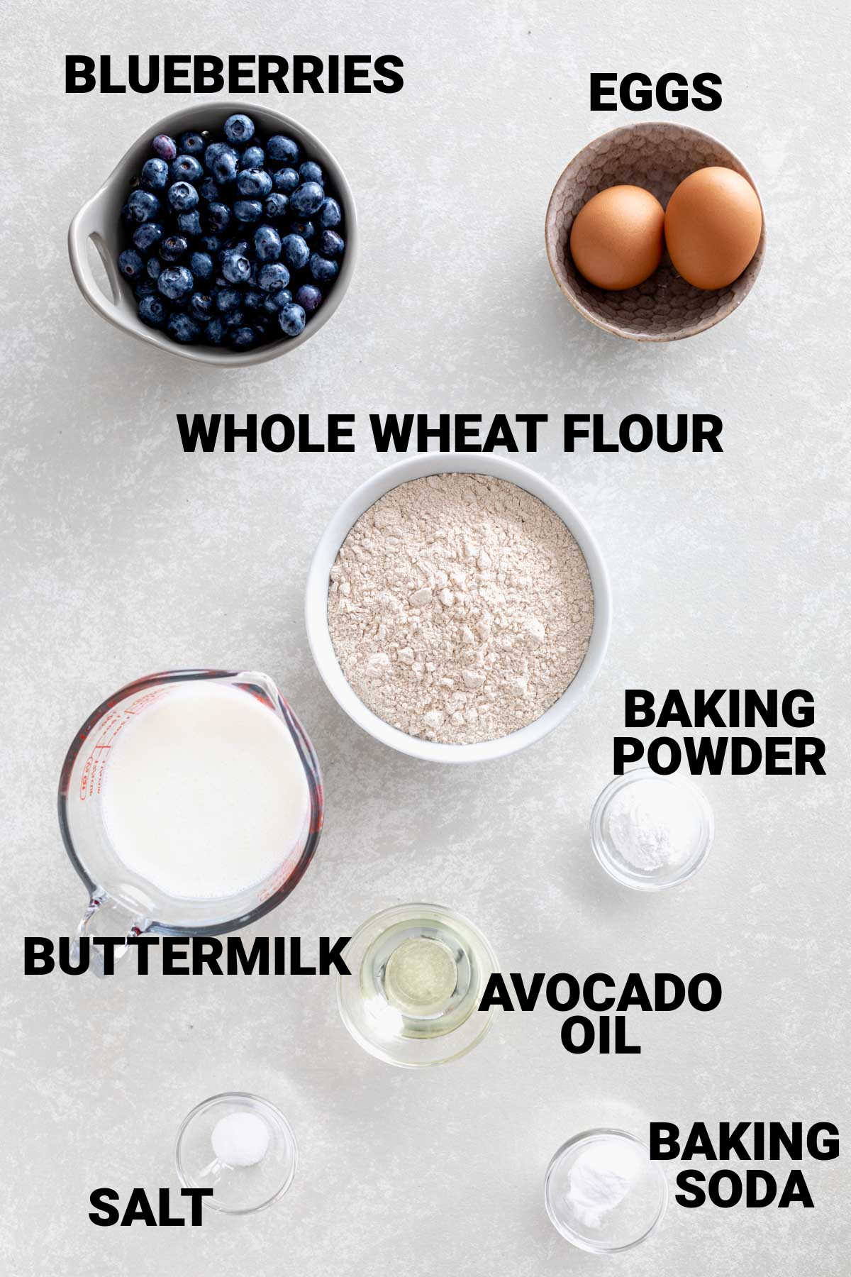 ingredients for blueberry pancakes made with whole wheat flour with text overlay
