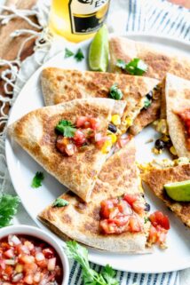 healthy chicken quesadillas sliced into wedges and topped with pico de gallo