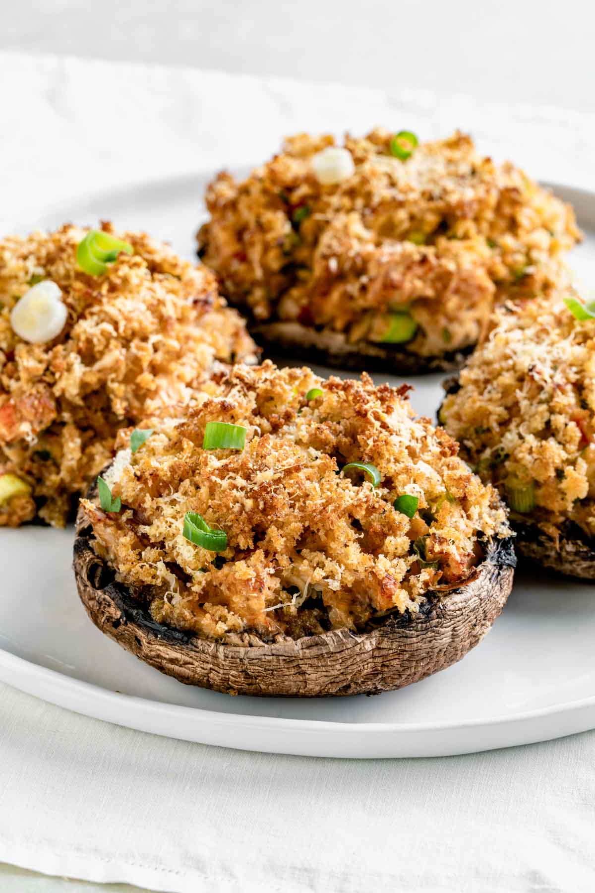 crab stuffed portobello mushroom caps topped with crunchy panko and scallions
