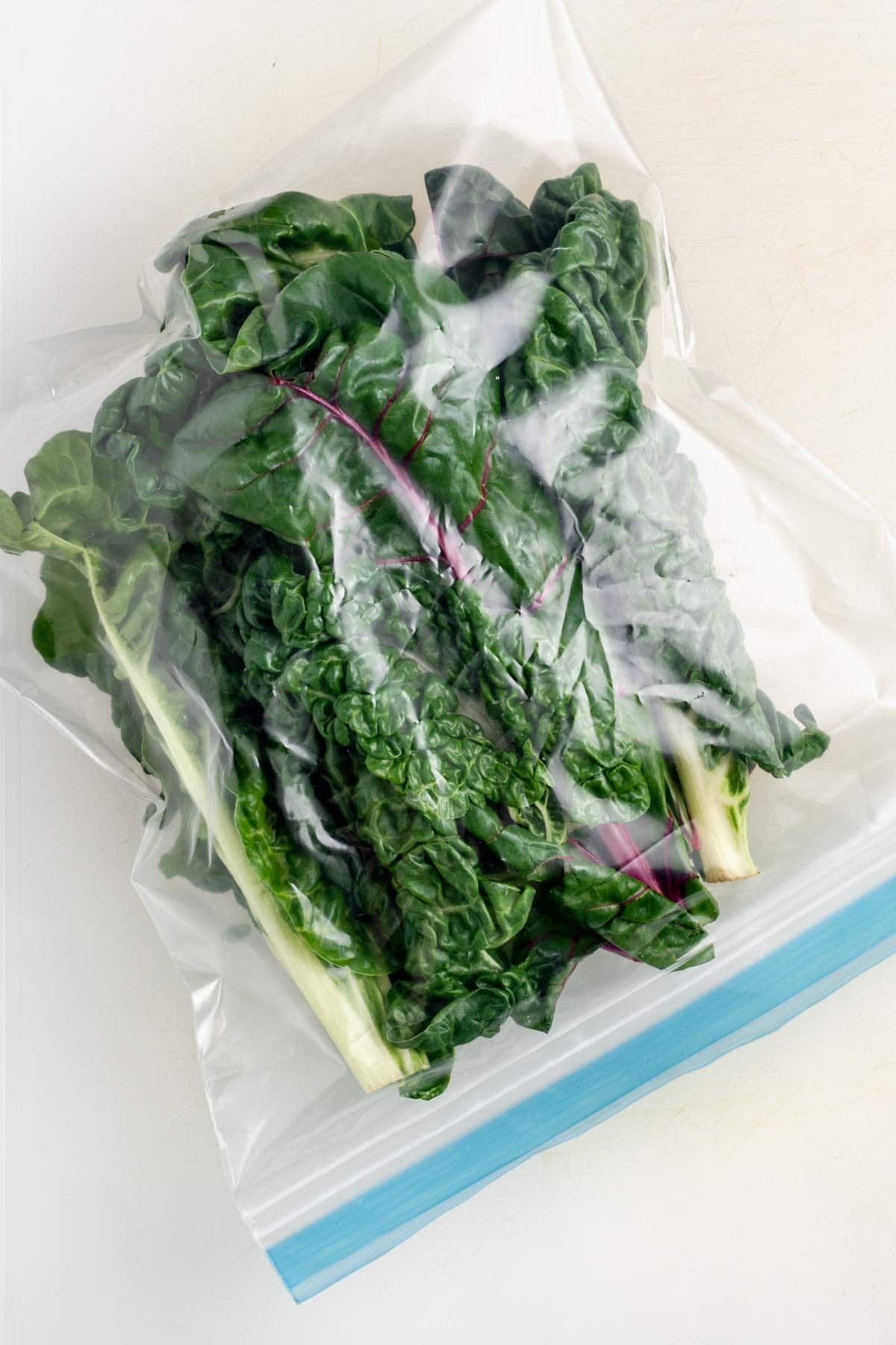 the chard leaves in the bag
